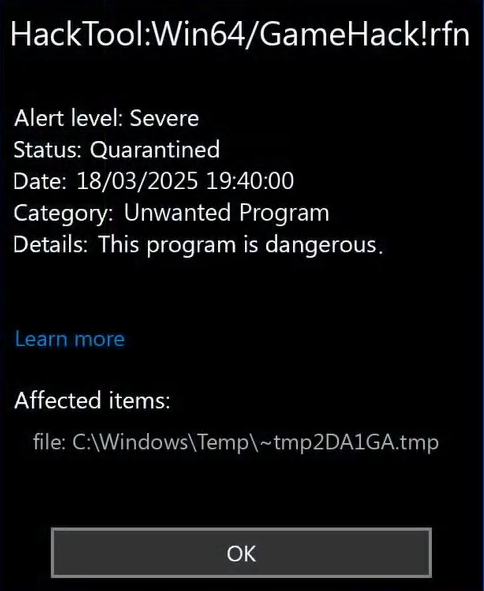 Windows Defender alert showing HackTool:Win64/GameHack!rfn detection with threat details and recommended actions